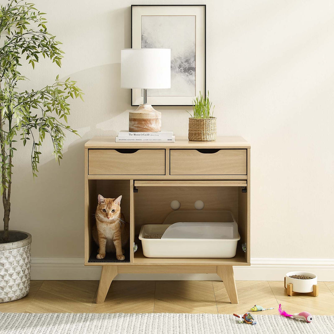 Gabinete para gato Niklas color roble en una sala junto a un gato.