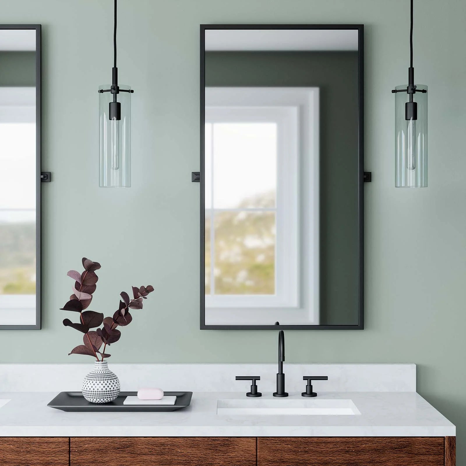 Lámpara colgante elegante negro con vidrio de cilindro Skye en un baño.