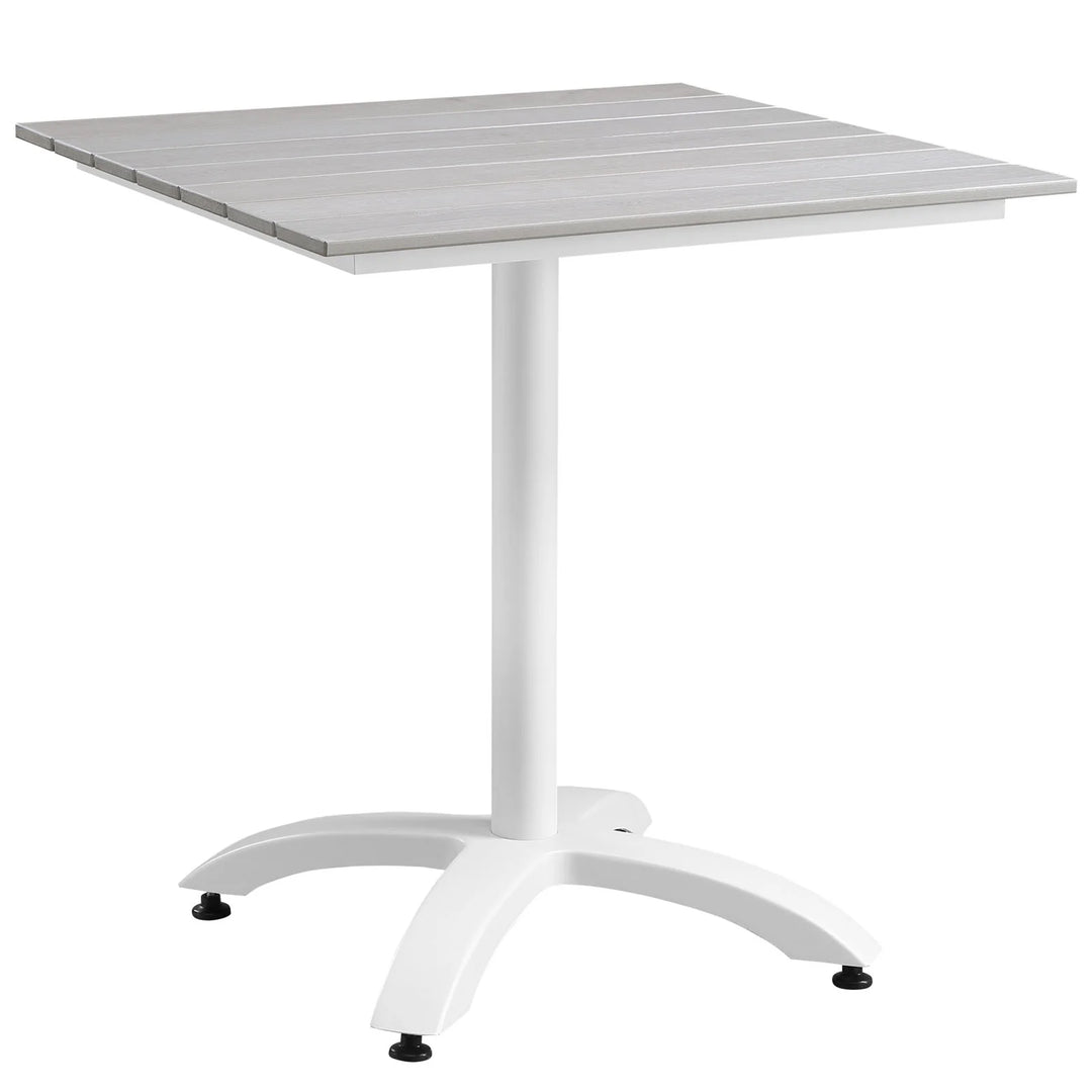 Mesa de comedor exterior de 28” de madera sintética y aluminio Lore color gris claro.