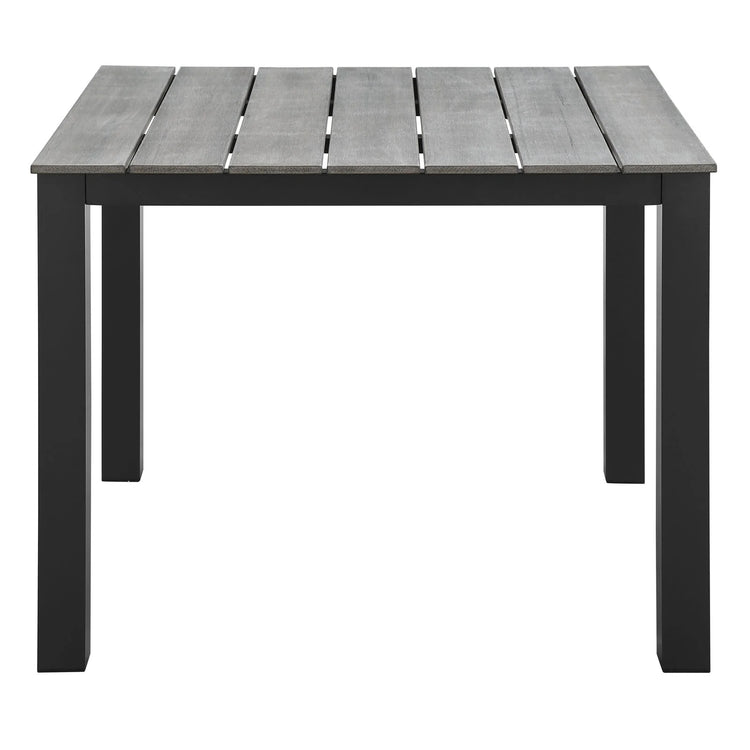 Mesa de comedor exterior de 40” Lore color marrón gris de frente.