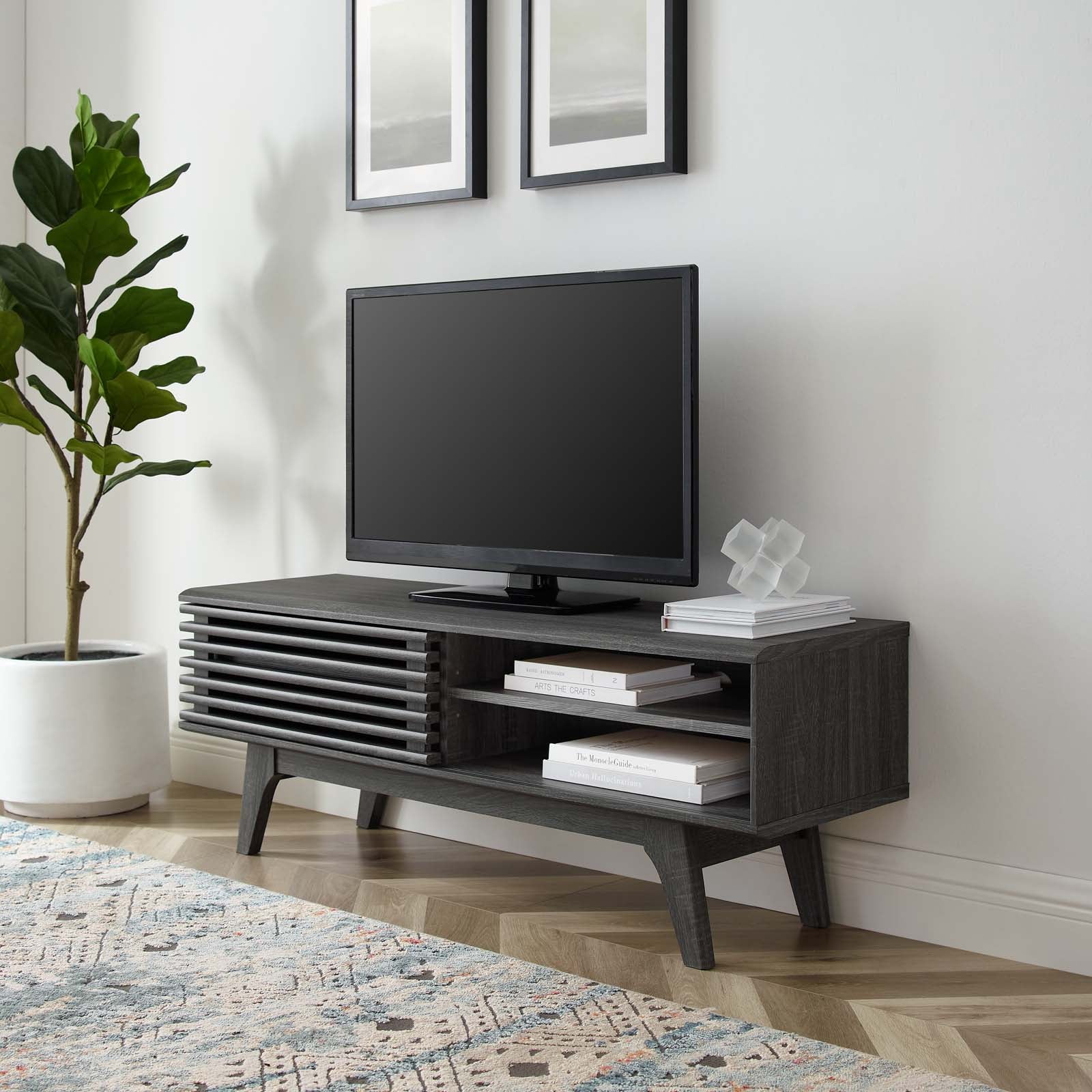 Mueble de 48” para TV Niklas color negro en una sala.