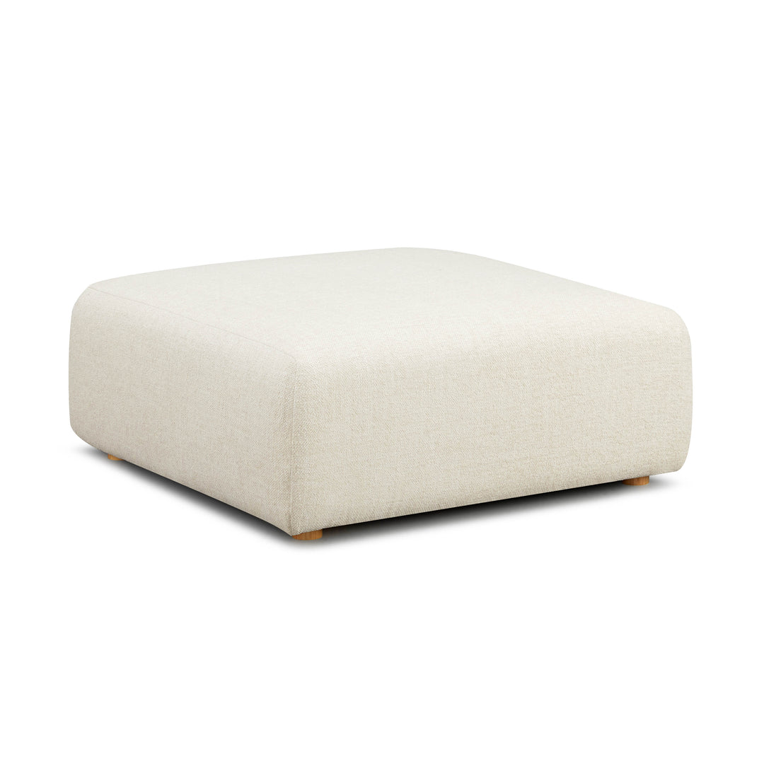 Ottoman Emory de tela gruesa texturizada color crema.