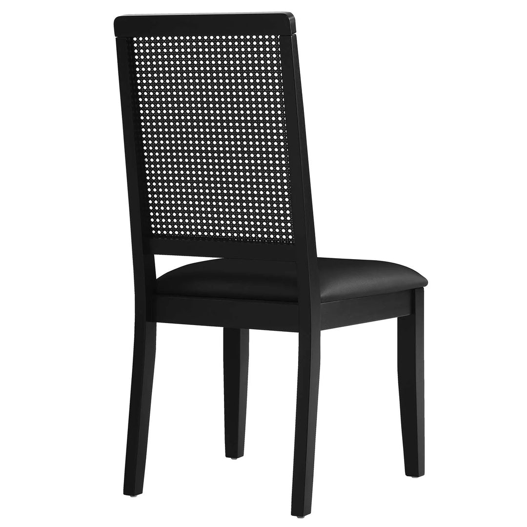 Silla de comedor de piel vegana color negro marco negro con ratán sintético Enzo de espaldas.