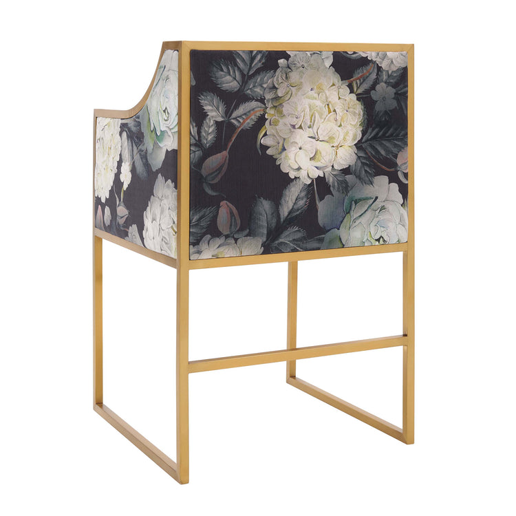 Silla de comedor moderna con terciopelo floral y acero inoxidable Aymen de espaldas.
