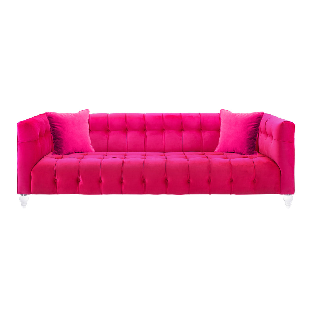 Sofá de terciopelo rosa ardiente Halima de frente.