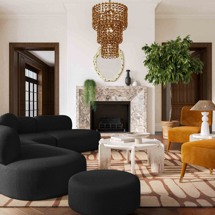 Sofá seccional de boucle negro Ilonnka en una sala.